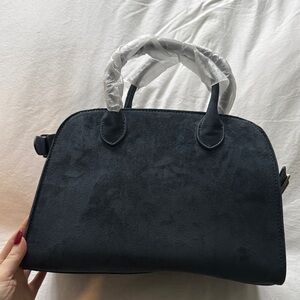 Blue suede handbag